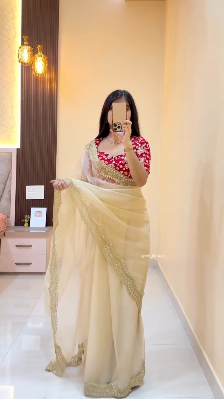 Cream saree with red blouse