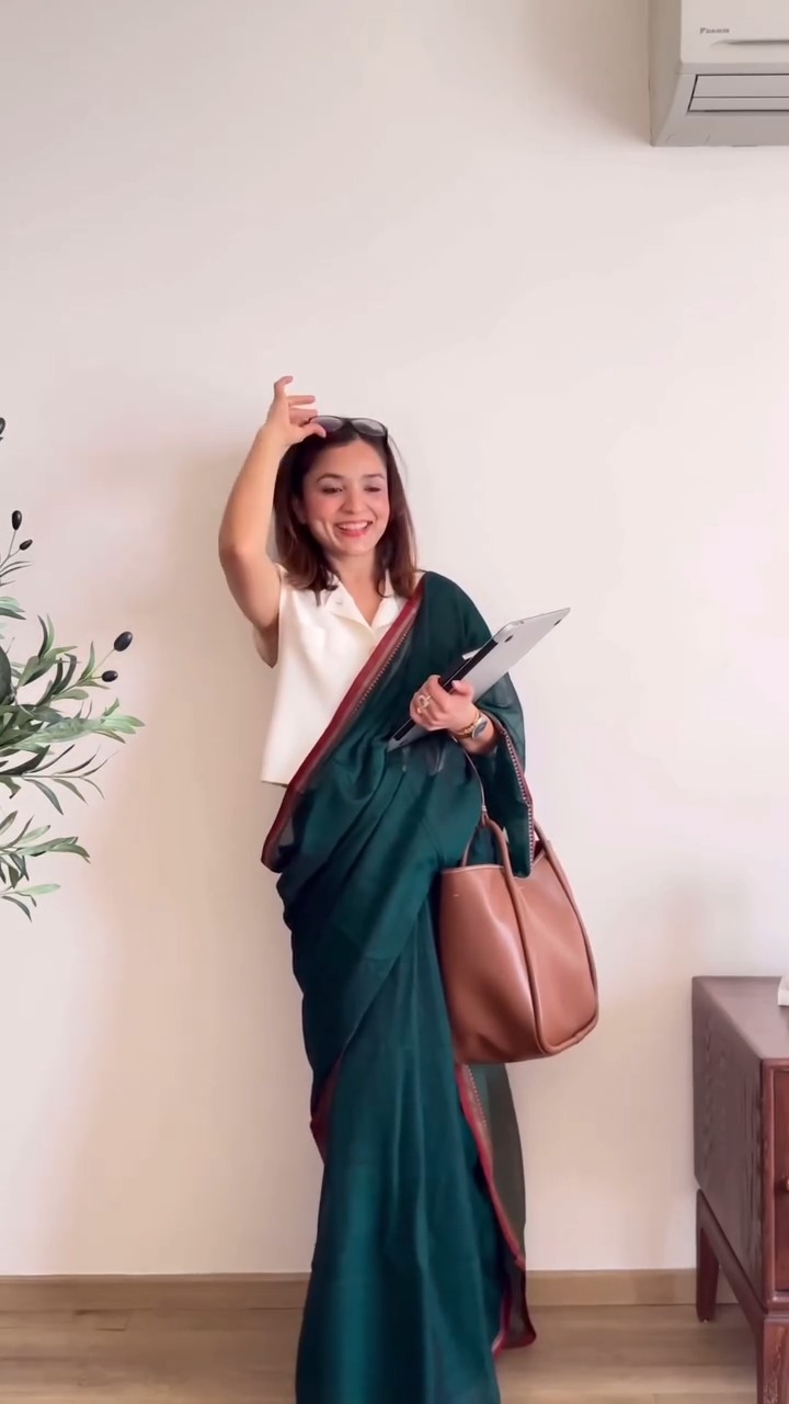 Elegant Deep Green Saree with Contemporary Sleeveless Blouse