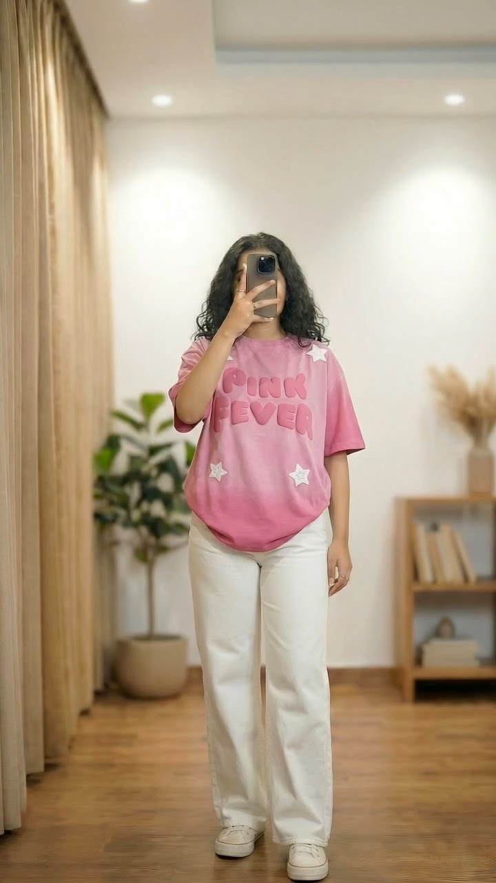 Pink graphic tee with white pants